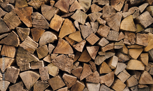 Bild auf Leinwand Firewood stack, Heap stacked dry firewood, background