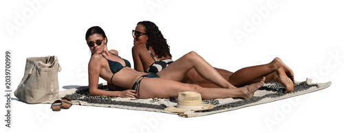 Photos Two women lying on the beach towel and sunbathing and talking, isolated on white
