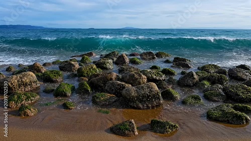 Ocean Waves Crashing on Rocky Shoreline, Coastal Beach Landscape