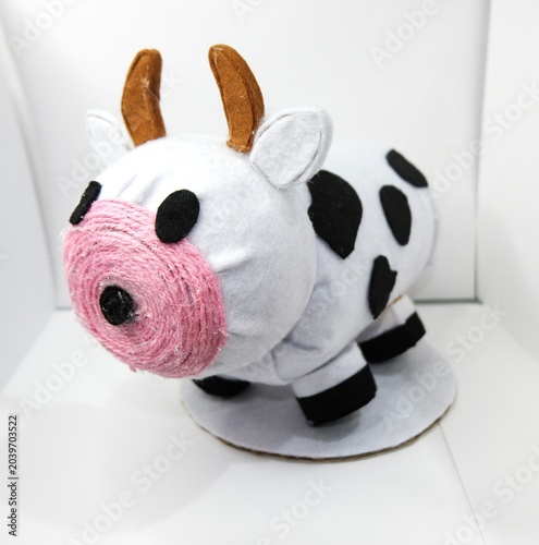 Handmade Cow Piggy Bank Craft on White Background
