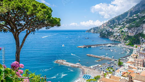 Amalfi town on Amalfi Coast viewed from above with harbor and marina, Mediterranean Sea, sunny summer travel destination concept
