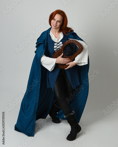 Quadro su tela full length portrait of female model wearing medieval fantasy warrior historical costume, blue cloak