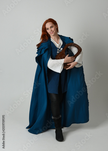 Quadro su tela full length portrait of female model wearing medieval fantasy warrior historical costume, blue cloak
