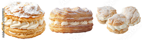 Foto Three cream puffs and two cream-filled pastries dusted with powdered sugar, isol