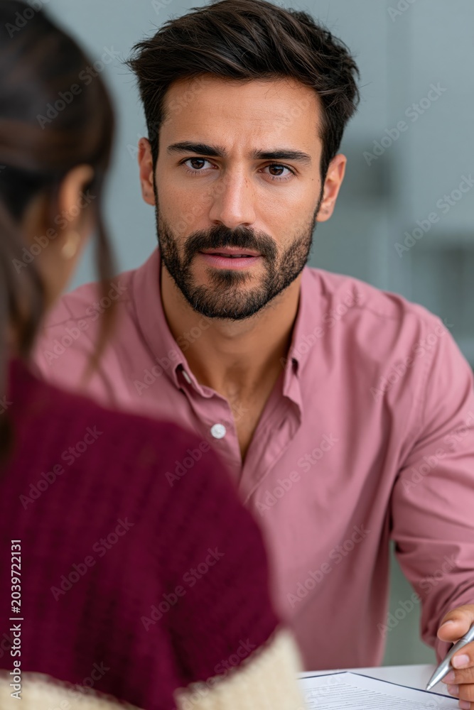 Fototapeta premium Man listening attentively during counseling session indoors