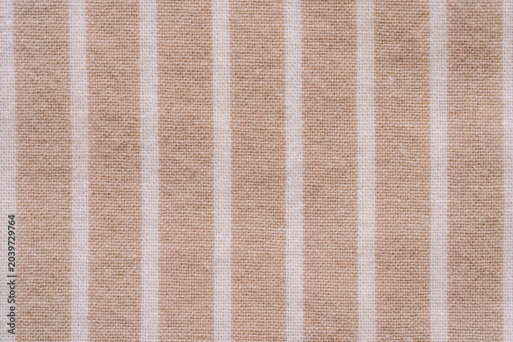 Fototapeta premium Beige striped fabric texture in close up.