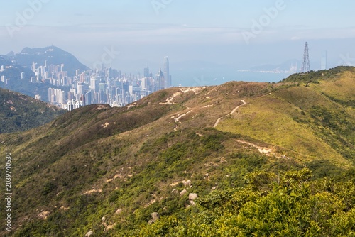 Dragon's Back ridge trail with Hong Kong skyline in the distance