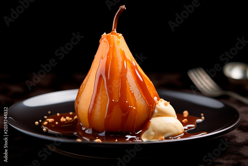 Dessert with caramelized pear on a plate.