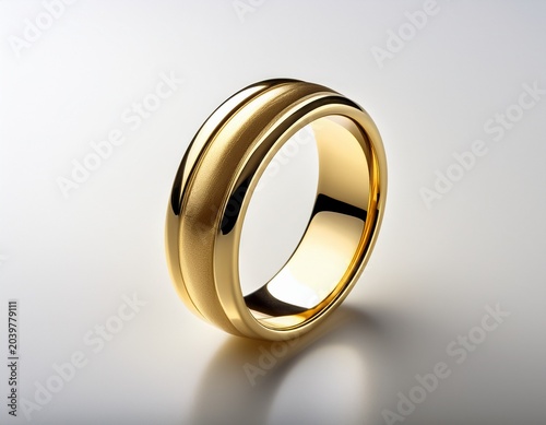 beautiful sleek matte solid gold ring on crisp white surface modern minimalist fine jewelry design