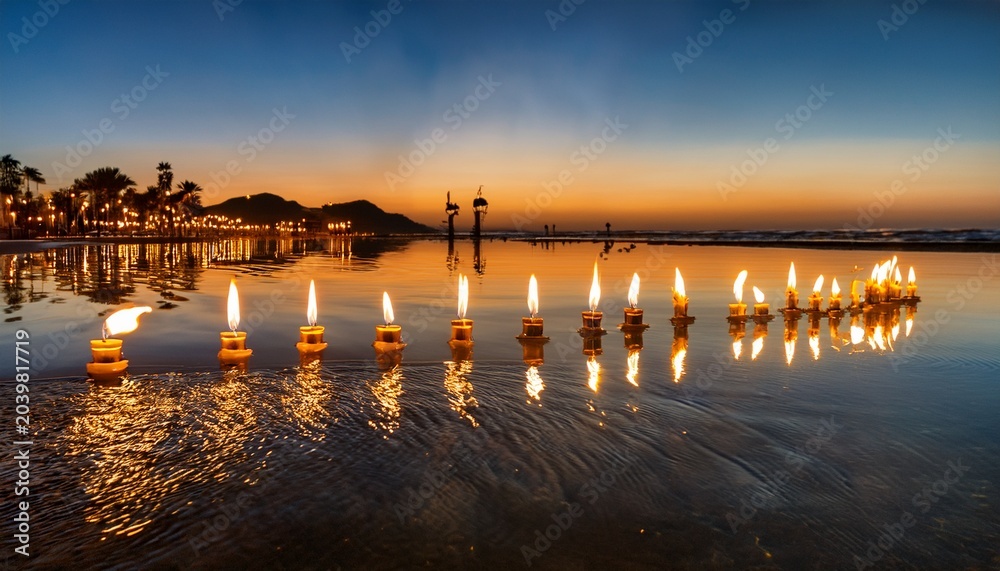 Obraz premium candlelit reflection a mesmerizing display of light and symmetry