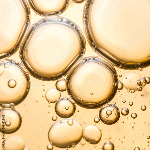 Golden oil bubbles macro background