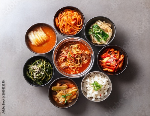 various korean cuisine dishes in bowls on the table top view