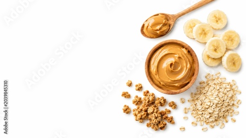 Healthy peanut butter with banana, oats, and granola on white