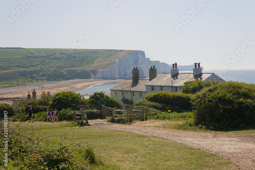 Принти на полотні Cottages and the Seven Sisters cliffs in East Sussex, UK