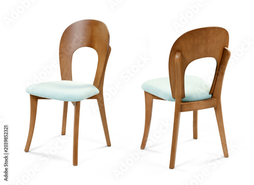 Two multi-angle perspective views showing the front angled profile and the back of a mid-century modern wooden dining chair with a mint blue cushion, isolated on a white background.