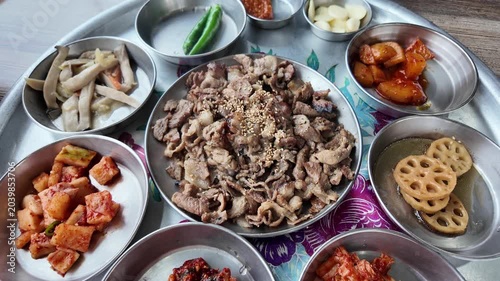 Traditional Korean Bulgogi Grilled Meat with Assorted Banchan Side Dishes