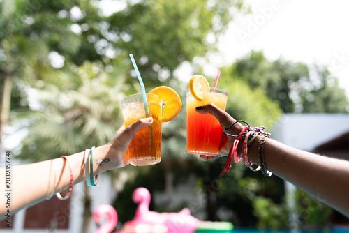 Fotografie Refreshing summer drinks by poolside