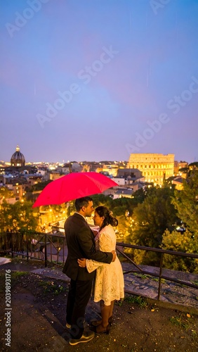 Romantic couple under a red umbrella in Rome at twilight