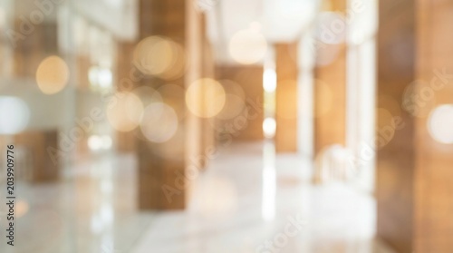 Cool Blurred hotel or office building lobby blur background interior view toward reception hall modern luxury white room space with blurry corridor and building glass wall window : Generative AI