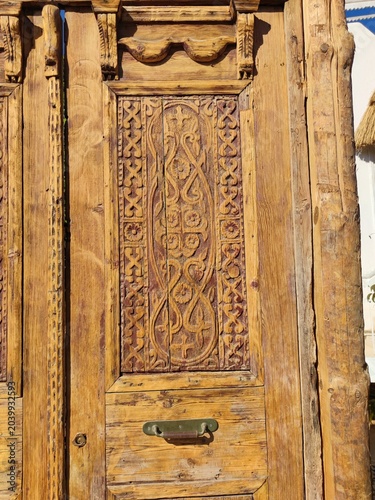old vintage door. ancient wooden door against. ancient natural wood background