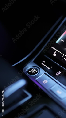 Vertical video of Pressing Stand By Power Button To Turn On and Off the Hybrid Car. Pushing start stop Button to start keyless ignition hybrid car electro engine. Button to start the car engine