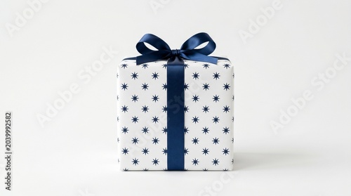 Elegant white gift box with navy blue star pattern and ribbon