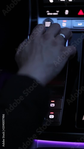 Automatic transmission, automatic gear shift, is moved to P Park. Automatic gear shift, is moved from D Drive. The driver's hand moved the gear selector to the reverse R mode. Transportation concept
