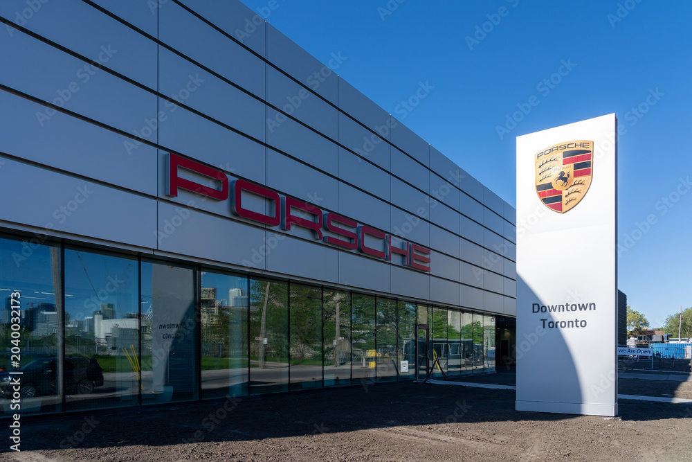 Naklejka premium Toronto, ON, Canada - May 30, 2026: Porsche Centre Downtown Toronto dealership on Cherry Street in Toronto, ON, Canada. Porsche is a German car manufacturer.