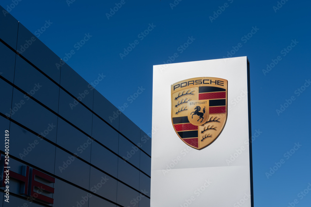 Naklejka premium Toronto, Ontario, Canada - May 30, 2026: Porsche crest at a Porsche Centre. Toronto, Ontario, Canada. Porsche is a German car manufacturer. 