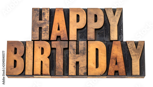 Vintage letterpress printing blocks spelling happy birthday, celebration and greeting typography