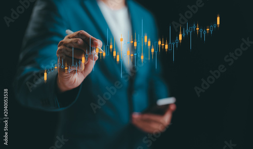 A Businessman analyzing graph financial data stock market. Business financial stock market concept. Business finance stock bar chart Hologram. Business success and growth, economic growth graph.