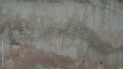 Old weathered concrete wall with cracks and mold texture background