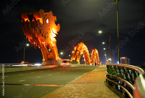 Canvastavla Golden dragon bridge lit up at night over Han River in Da Nang Vietnam