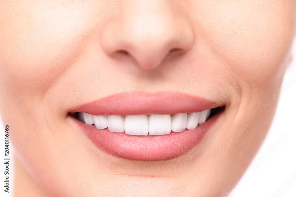 Fototapeta premium Smiling human face close-up, showing perfect teeth