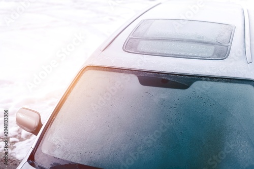 Photography Hoarfrost on frozen car glass in cold season