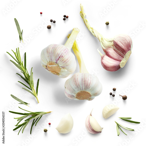 Foto Art Fresh organic garlic bulbs green rosemary leaves and peper isolated on white background