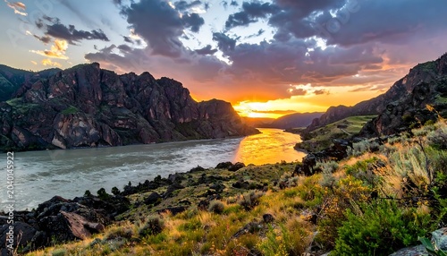 Golden sunset over tranquil mountain lake.