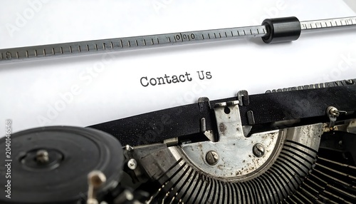 Close-up of vintage camera lens with contact details.