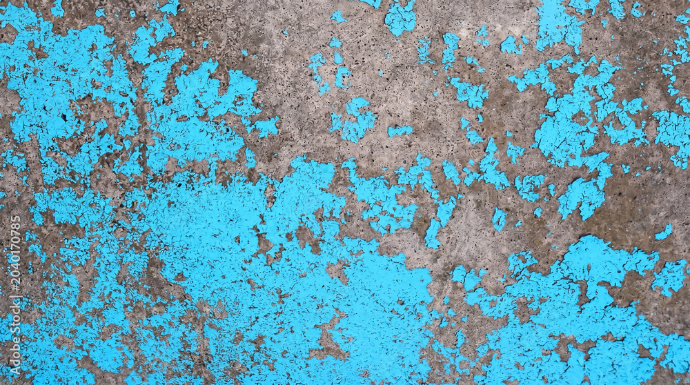 Fototapeta premium Peeling bright blue paint on rough concrete wall texture for grunge industrial backdrop and vintage graphic design