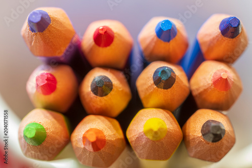 Top view macro of multicolored sharpened pencils in a cluster