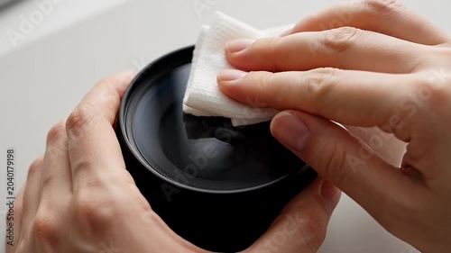 Hands Cleaning Black Container with White Cloth, Hygiene and Care