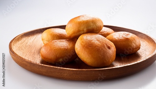 board and plate of tasty bonda with on white background