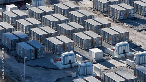 Aerial view on battery energy storage system for renewable power plant. Industrial lithium batteries facility for clean electricity grid management and sustainable technology infrastructure.