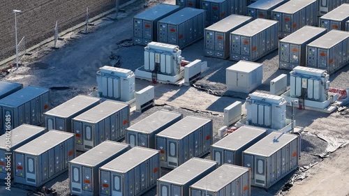 Aerial view on battery energy storage system for renewable power plant. Industrial lithium batteries facility for clean electricity grid management and sustainable technology infrastructure.