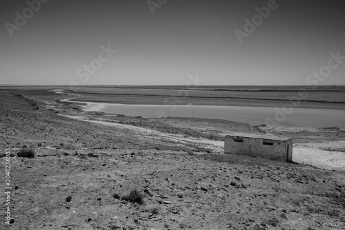 Amudarja or Amu Darya River, the Border between Uzbekistan and Turkmenistan with a Dilapidated Building Black and White