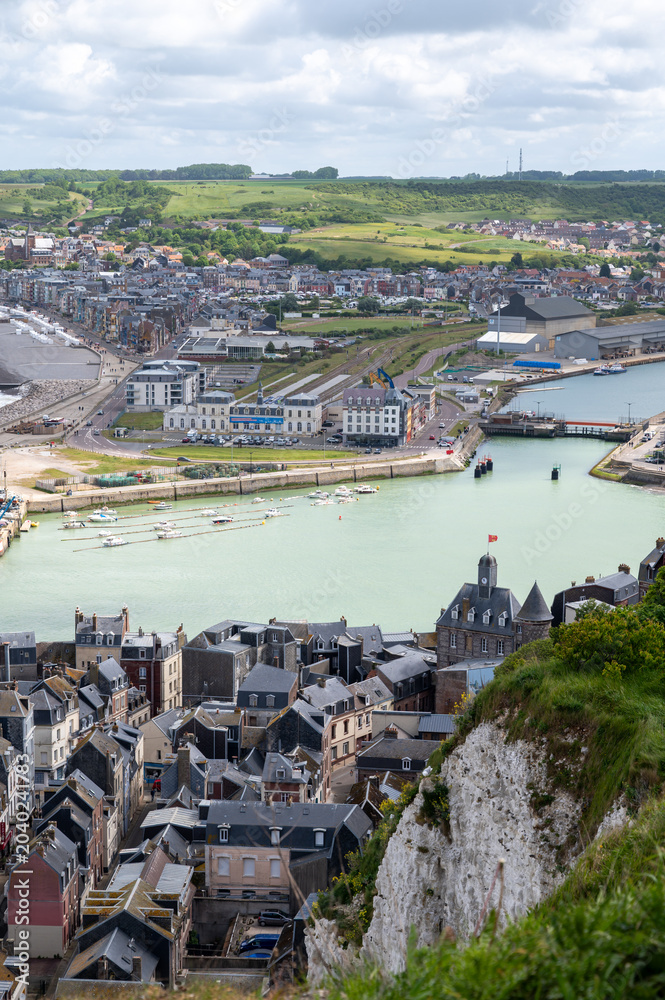 Obraz premium Views from view point on cliffs of Le Treport, seaside resort in Normandy, France, with white cliffs along English Channel, fishing industry and old buildings, travel destination in France
