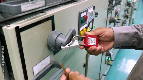 Lockout Tagout (LOTO) safety procedure using a padlock on the main electrical disconnect switch to isolate hazardous energy, ensuring worker protection during maintenance, inspection, and repair activ