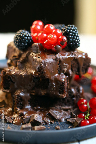 brownies with chocolate and berries