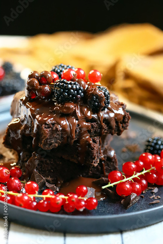 brownies with chocolate and berries