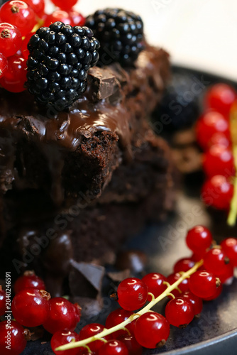 brownies with chocolate and berries